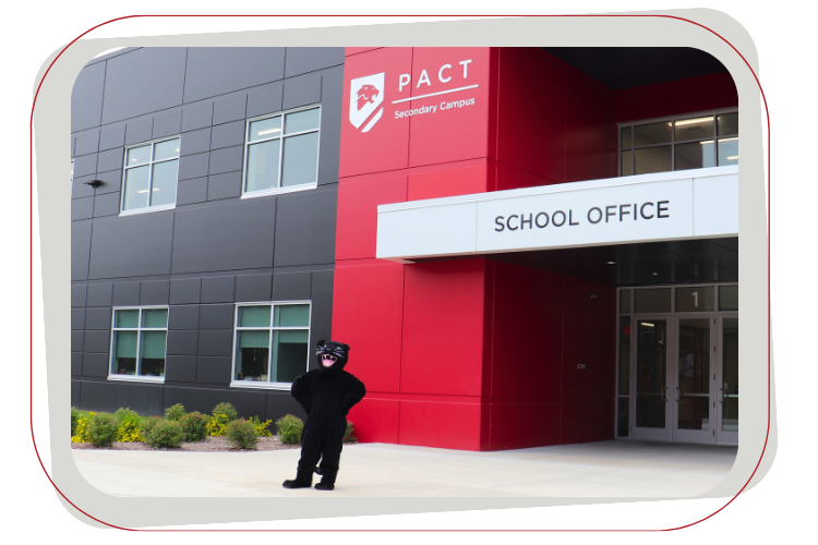 panther mascot standing in front of building
